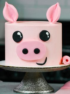 a close up of a cake with a pig face on it