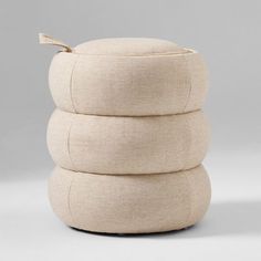 three round pillows stacked on top of each other