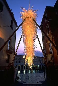 a large firework hanging from the side of a building