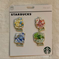 starbucks pin set with four different pictures on it