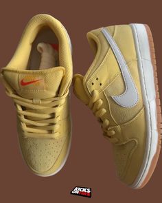 a pair of yellow nike air force sneakers