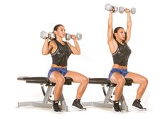 two women doing squats with dumbbells in front of their backs, one sitting on a bench and the other standing behind her