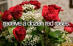 red roses and baby's breath in a vase with the words i receive a dozen red roses