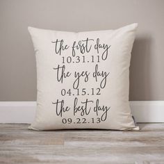 a white pillow with the words, the first day and the best day printed on it