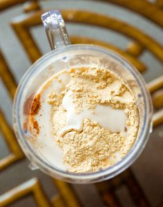 a blender filled with food on top of a table