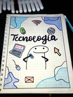 a notebook with the word tecnologia written on it next to markers and pens