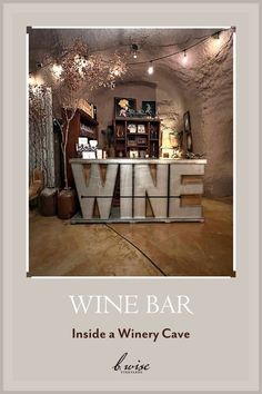 wine bar inside a winery cave with the words wine written in large letters on it