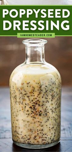 poppy seed dressing in a glass jar on a wooden table with text overlay that reads poppy seed dressing