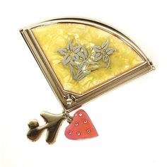 a brooch that is sitting on top of a table