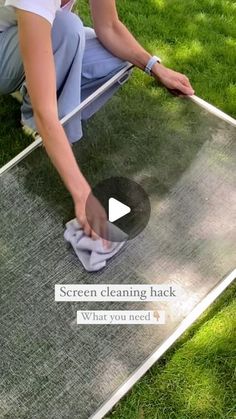 a person is cleaning the grass with a cloth on it and an object in front of him that says screen cleaning back what you need