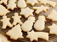 cookies are cooling on a wire rack and ready to be baked in the oven for christmas