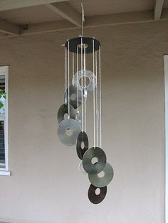 a wind chime hanging from the side of a building