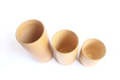 three wooden cups sitting next to each other