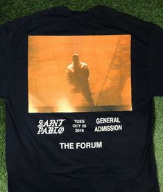 a black t - shirt with an image of a man on it