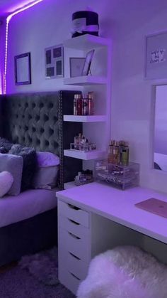 a bedroom with purple lighting in the ceiling and white fur rugs on the floor