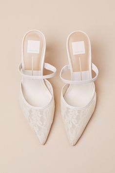 Designed for the most ethereal occasions, the Dolce Vita Katik White Floral Lace Pointed-Toe Mule Pumps will help you step out in fairytale-inspired style! Sheer, floral mesh lace shapes these classy pumps that feature a timeless pointed-toe upper with a low-cut collar and a slender, genuine leather vamp strap (with a bit of elastic at the side for fit). A sultry stiletto heel completes the sleek slide-on silhouette! 3. 25" wrapped stiletto heel. Cushioned insole. Felted rubber sole has nonskid markings. Genuine Leather Accents. Man Made Materials. Imported. Lulus | Katik White Floral Lace Pointed-Toe Mule Pumps | Size 9.5. Mule Pumps, Comfortable Bridal Shoes, Lace Pumps, Wedding Heels, Leather Accents, Ivory Lace, Product Photos, Bridal Shoes, Stiletto Heel