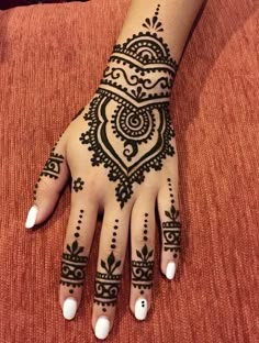 a henna tattoo on someone's hand