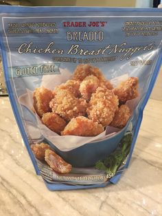 trader joe's breaded chicken breast nuggets in a blue plastic bag