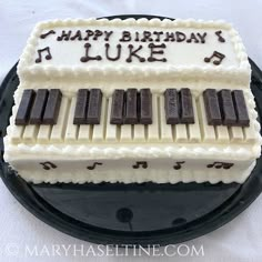 a birthday cake that is decorated with music notes