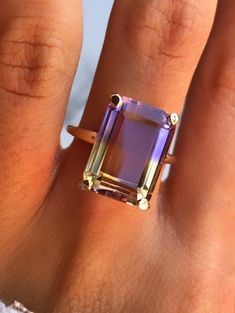 "7.6Ct Emerald-Cut Ametrine Solitaire Ring in 14k Yellow Gold"*Ametrine is a powerful combination of Amethyst and Citrine, Connecting Physical and Spiritual realms*Ametrine Carat Weight: 14mm x10 mm Ametrine --- 7.6Ctthe Slightly bigger Ametrine is Available, please click the link below to check the 10Ct (15 x 11mm) Ametrine:https://www.etsy.com/listing/879661902/6ct-ametrine-ring-14k-yellow-gold?ref=listing_published_alertSolid 14k Rose Gold and White Gold are available as well.*Box Included*Pl Ametrine Ring, Amethyst And Citrine, Ring Emerald Cut, Emerald Wedding Rings, Moissanite Solitaire Ring, Best Engagement Rings, Ring Emerald, Sterling Silver Engagement Rings, Emerald Engagement