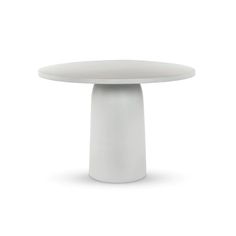 a white table sitting on top of a white floor