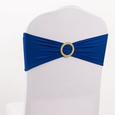 Royal Blue Stretch Chair Sashes Royal Blue Stretch Chair Sashes Elevate your event decor to a realm of majestic elegance with our Royal Blue Spandex Stretch Chair Sash Bands, adorned with opulent Gold Diamond Ring Slide Buckles. These chair sash bands are not just accessories; they are a symbol of your dedication to style and meticulous attention to detail. Crafted from premium spandex material, these sashes are renowned for their durability and remarkable flexibility, ensuring a secure and snug fit on various chair sizes and shapes. The deep and regal royal blue color exudes an aura of opulence and sophistication, making them the perfect choice for weddings, galas, or any event where you aim to make a statement. Royal Blue Chair Bows with Gold Buckles Royal Blue Chair Bows with Gold Buckl Elegant Blue Party Sashes, Royal Blue Chair, Chair Bows, Chair Bands, Chair Sash, Chair Sashes, Blue Chair, Royal Blue Color, Gold Rhinestone