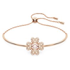 This charming bracelet from the Idyllia family will add a touch of luxury to any look. Sitting on a chain with an adjustable closure, the rose gold-tone plated design features a lucky clover motif crafted with a central pink Swarovski Zirconia and four leaves embellished with a pavé of clear crystals. Style with a pair of Idyllia clover earrings for a nature-inspired look. Feminine Rose Gold Bangle Jewelry, Adjustable Feminine Rose Gold Bracelets, Bracelet Clover, Pink Crystal Bracelet, White Clover, Rose Bracelet, Pink Swarovski, Clover Earrings, White Bracelets