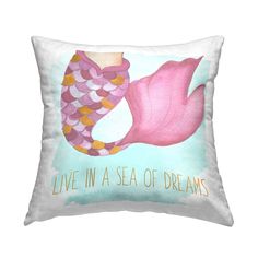 a pink mermaid pillow with the words live in a sea of dreams