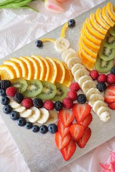 sliced up fruit arranged on a cutting board