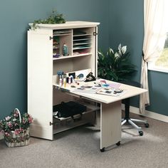 an image of a white desk with drawers and shelves on it in the middle of a room