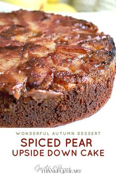 a close up of a piece of cake on a plate with the words spiced pear upside down cake