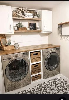 a washer and dryer sitting in a room next to a wall with shelves