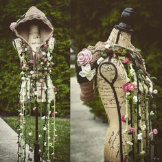 two mannequins decorated with flowers and ribbons