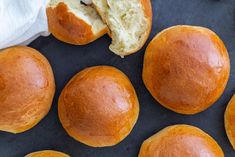 some bread rolls are laying on a table