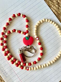 Red colored lanyard with wooden and plastic beads designed to go over head with ease. Includes a tassel. This lanyard goes great for keys, or identification card. Optional Identification sleeve available for purchase. Homemade Lanyards Diy, School Lanyard, Lanyard Ideas, Acrylic Nails Almond Shape, Lanyard Teacher, Diy Key, Future Job, Lanyard Necklace