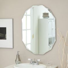 a bathroom sink with a mirror above it