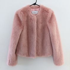 This Stand Sofia Cropped Faux Fur Jacket In Soft Pink Is A Stand Out Piece, Perfect To Wear With Dresses/Skirts, Or Add A Little Fun To Jeans And A T-Shirt. Cut For A Cute Cropped Fit And Featuring Two Side Pockets, A Hook And Eye Fastening And A Round Collar For Timeless Elegance, This Jacket Layers Up Casual Looks Or Adds Stylish Warmth To Evening Looks. - Faux Fur Outer - Hook And Eye Fastening - Two Side Pocket - One Internal Zippered Pocket - Fully Lined Size 34 (Us 4/Small) Spring Workwear Fur Coat With Faux Fur Lining, Spring Faux Fur Workwear Coat, Spring Workwear Faux Fur Coat, Spring Faux Fur Lined Outerwear For Work, Spring Workwear Outerwear With Faux Fur Lining, Pink Fur Jacket, Pink Faux Fur Coat, Pink Fur Coat, Faux Fur Cropped Jacket