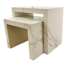 a white marble desk with an open shelf