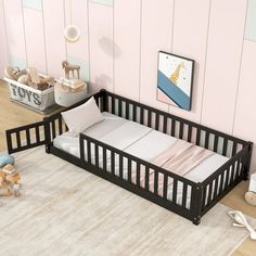 a baby's room with a crib and toys on the floor