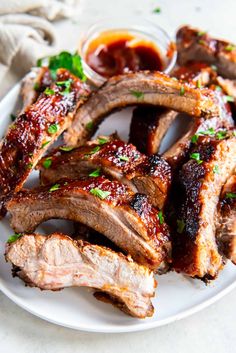 barbecue ribs on a plate with ketchup and parsley