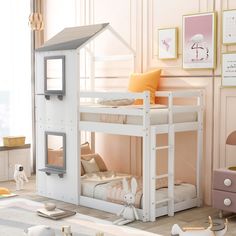 a child's bedroom with a white bunk bed and pink walls, decorated in pastel colors