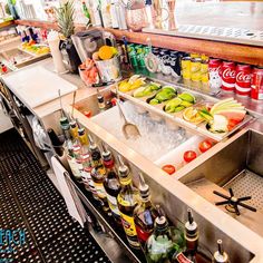 an image of a bar with drinks on the counter