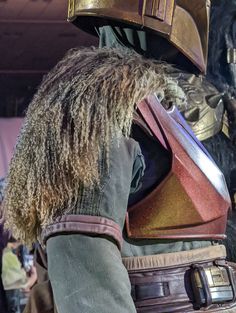 a close up of a person wearing a costume