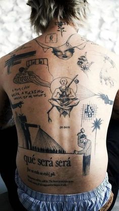 the back of a man with tattoos on his body