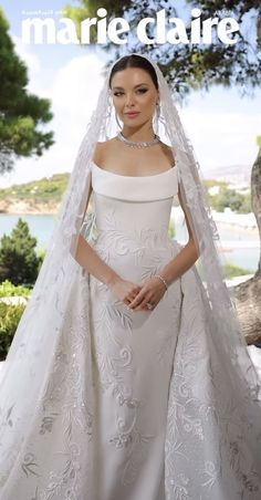 a woman in a wedding dress and veil posing for a magazine cover with the words marie claire on it