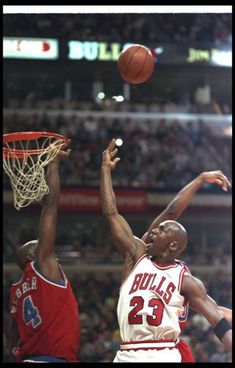 two basketball players in action on the court