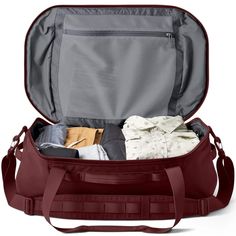 an open suitcase filled with clothing and other items