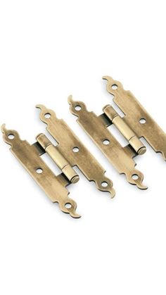 three brass plated cabinet door hinges