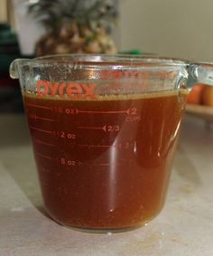 a blender filled with brown liquid on top of a counter