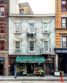 an old brick building on the corner of a street